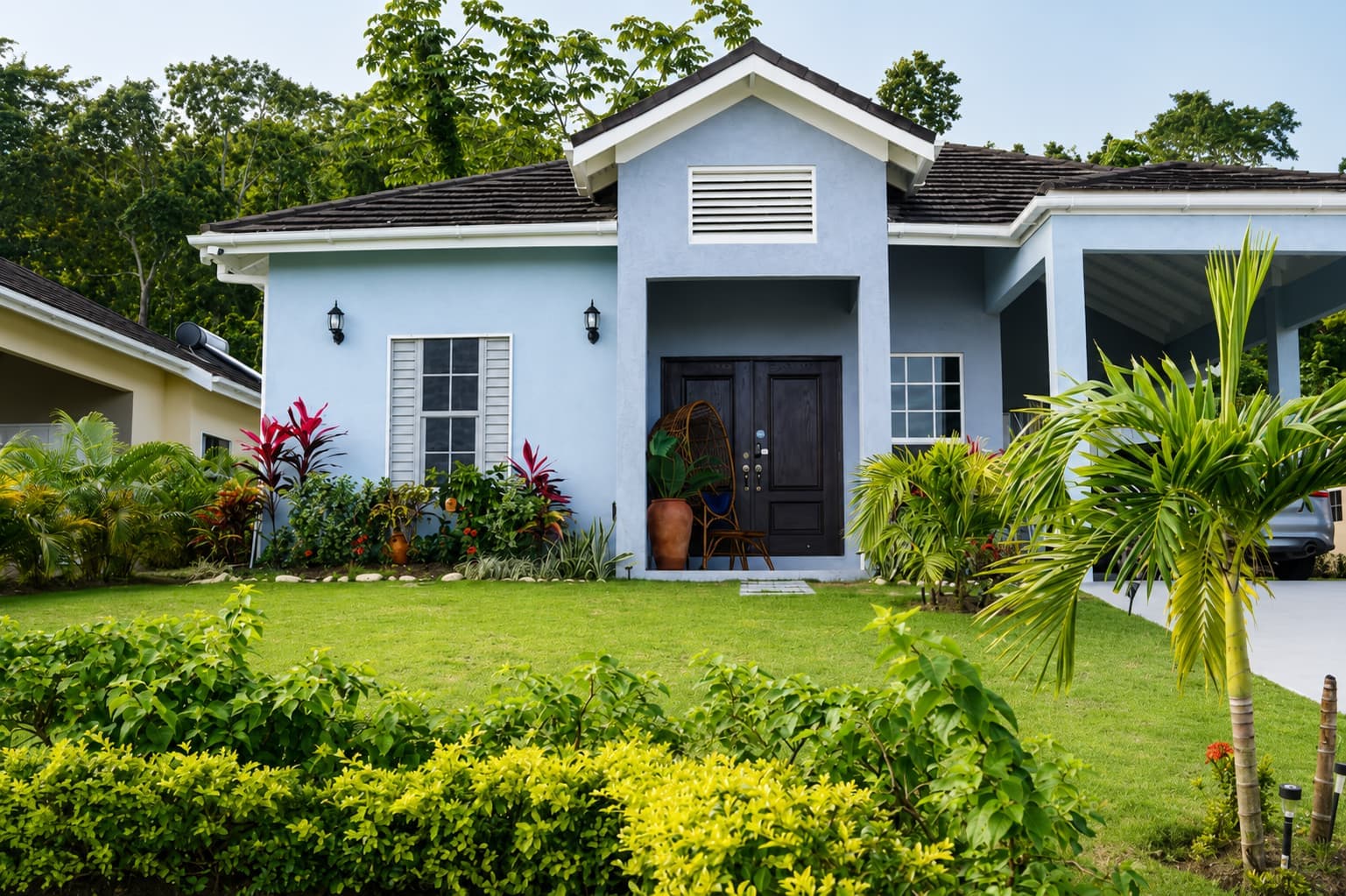 The main front entrance of our beautiful St. Mary, Jamaica holiday villa showcases the stunning tropical exterior and welcoming island architecture.
