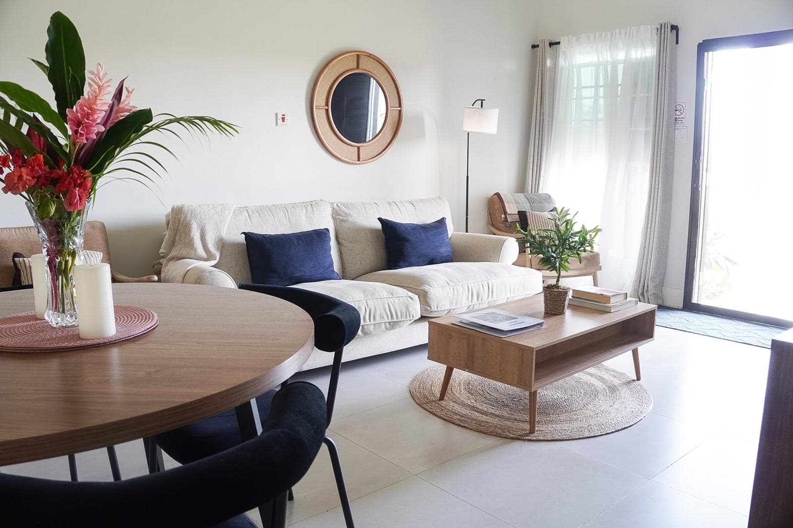 The spacious living room offers plenty of comfortable seating and modern amenities for a relaxing Caribbean vacation.